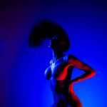 07 245 Boudoir Photography in a Colorful Light Setting